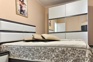 A bed or beds in a room at St George Apartment
