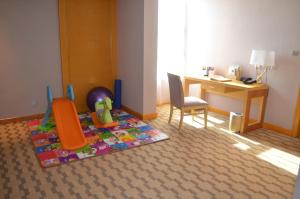 Postel nebo postele na pokoji v ubytování Hui Fu Jinling Hotel