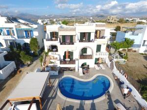 
a large white building with a lot of windows at Orama Apartments in Agia Anna Naxos
