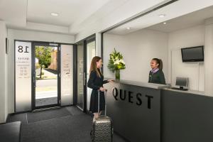 two women standing at a desk in an office at Quest on Rheola in Perth