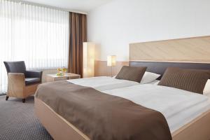 Voodi või voodid majutusasutuse nordica Hotel Friesenhof toas
