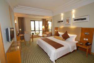 Cama ou camas em um quarto em Jinling Tianming Grand Hotel Changshu