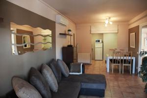 a living room with a couch and a dining room at Laquilla II in Platja  d'Aro