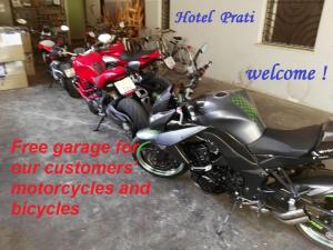 a group of motorcycles parked in a garage at Hotel Prati in Castrocaro Terme