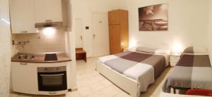 A kitchen or kitchenette at Residence Hotel Vittoria