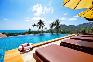 a swimming pool with a view of the ocean at Siam Sunrise Seaview in Chaweng