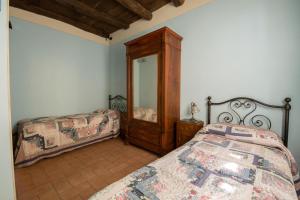 A bed or beds in a room at Il Nido - Private villa with pool and jacuzzi