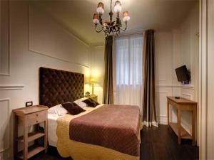 A bed or beds in a room at The B Place