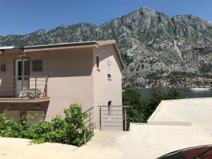 a house with a view of a mountain at Apartmani Cuce in Kotor