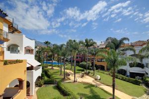 an aerial view of a resort with palm trees at Luxury Apartment In Marbella in Marbella