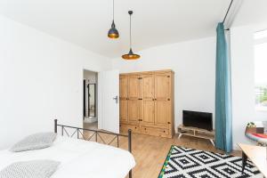 Llit o llits en una habitació de Brancusi Apartment