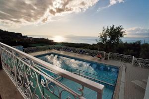 a swimming pool on the balcony of a building at Hotel Dania in Sorrento