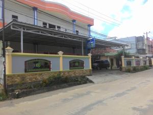 a gas station on the side of a street at Losmen Ibu Hj. Tarjo in Palembang