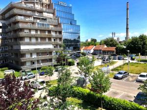 a parking lot in front of a large building at Apartment Luka in Zagreb