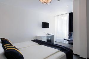 Postel nebo postele na pokoji v ubytování B Gold Luxury rooms B&B