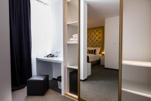 Postel nebo postele na pokoji v ubytování B Gold Luxury rooms B&B