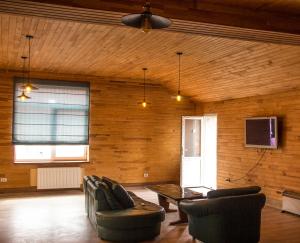 a living room with two couches and a table at Freedom in Uzhhorod