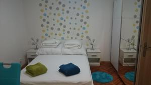 a bedroom with a bed with two pillows on it at Študio Apartman Jakobyho in Košice