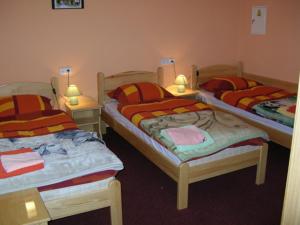 A bed or beds in a room at Natur Sport