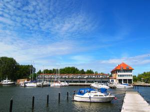 a group of boats are docked in a marina at Ferienapartment Sonnensegler Insel Usedom in Karlshagen