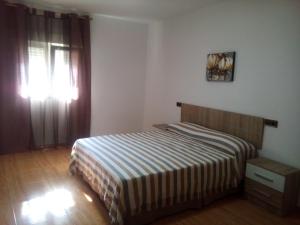 Postelja oz. postelje v sobi nastanitve Apartamento Centro