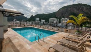 a swimming pool on the roof of a building at Copacabana Mar Hotel in Rio de Janeiro