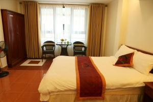 Postel nebo postele na pokoji v ubytování Son Ha Hotel SAPA