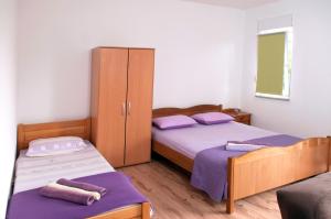 Postel nebo postele na pokoji v ubytování Apartment Kraljević