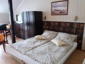 Posteľ alebo postele v izbe v ubytovaní Kaiser Apartman