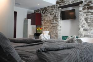Televiisor ja/või meelelahutuskeskus majutusasutuses Albergo Porta Verzasca