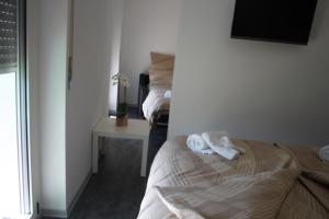 Voodi või voodid majutusasutuse Albergo Porta Verzasca toas