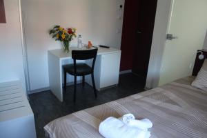 Voodi või voodid majutusasutuse Albergo Porta Verzasca toas
