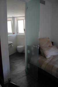 Voodi või voodid majutusasutuse Albergo Porta Verzasca toas