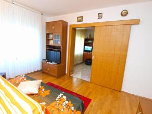 a living room with a door leading into a room at Apartment Marija 1389 in Fažana