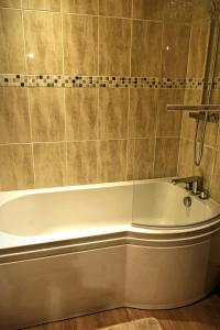 a bathroom with a bath tub in a room at The Wharf Stourport in Stourport +10 photos