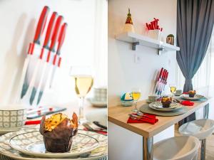 a dining room with a table with plates and wine glasses at IDRO Studio Apartments directly at the beach in Split