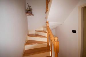 a staircase in a house with wooden steps at Dario Room in Novigrad Istria