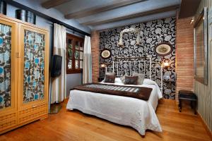 A bed or beds in a room at Hotel Boutique Maribel (Adult Only)