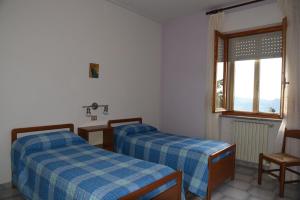 Postel nebo postele na pokoji v ubytování Albergo Dei Bersaglieri
