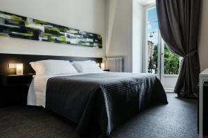 Postel nebo postele na pokoji v ubytování Residenza Navona Verona