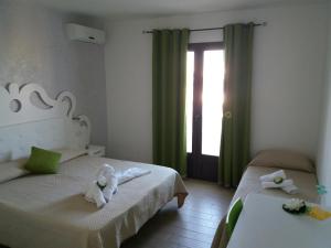 A bed or beds in a room at Tesori del Salento