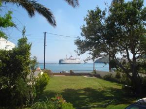 a cruise ship in the water with a park at House near Sea in Gavrio
