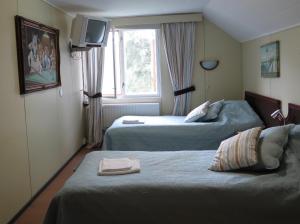 Giường trong phòng chung tại Hotel Laatokan Portti