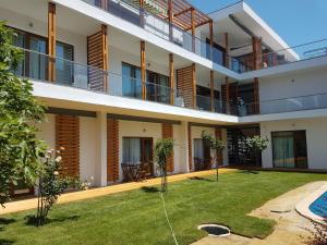 an external view of a building with a yard at Kiara Apartments in Saints Constantine and Helena