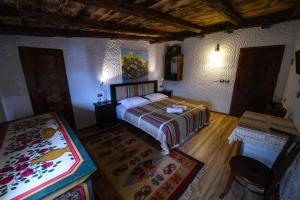 Voodi või voodid majutusasutuse Hotel Tradita toas