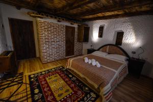 Voodi või voodid majutusasutuse Hotel Tradita toas