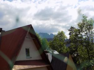 a view of a house with a roof at Apartament Droga na Bystre 9a in Zakopane