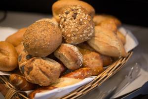 a basket filled with lots of different types of bread at Hotel Heiligenstein in Baden-Baden