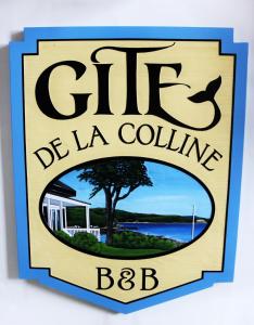 znak dla klubu de la colline bbc w obiekcie Gîte de la colline w mieście Baie-Sainte-Catherine