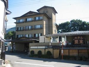 a building with writing on the side of it at Hotel Housei in Yamanouchi